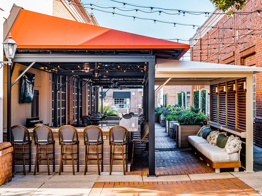 View of the patio with awnings at the Peninsula Prime, in Cornelius, NC